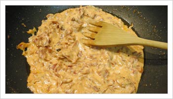 In a bowl dilute the remaining cream with some of the water used for the pasta and stir in the parmesan