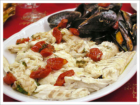 Spigola con le cozze al forno