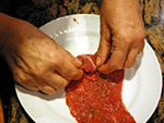 Meat bundles with tomato sauce