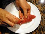 Meat bundles with tomato sauce