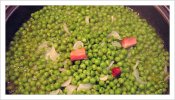 Add the peas and water enough to cover, and add salt and pepper